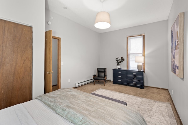 carpeted bedroom featuring baseboard heating