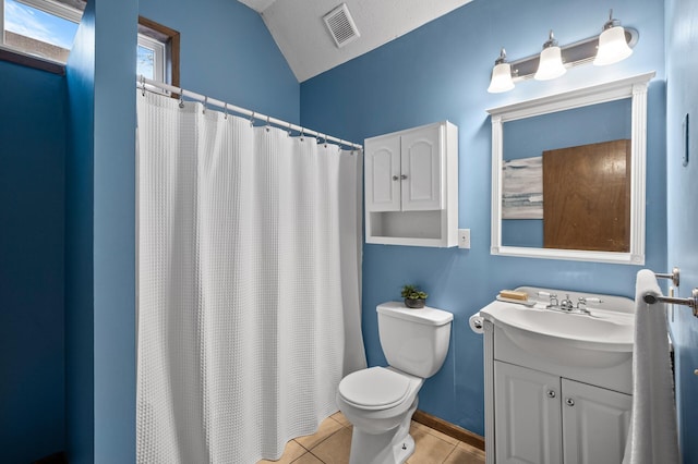 bathroom featuring lofted ceiling, visible vents, toilet, vanity, and tile patterned flooring