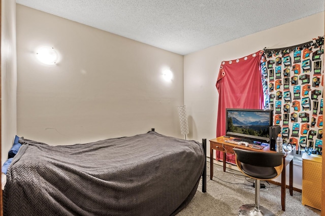 bedroom with carpet floors and a textured ceiling