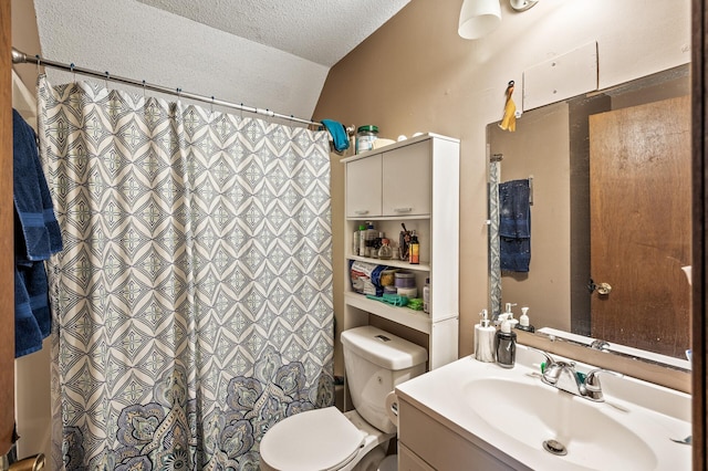 bathroom featuring a textured ceiling, toilet, a shower with shower curtain, vanity, and vaulted ceiling