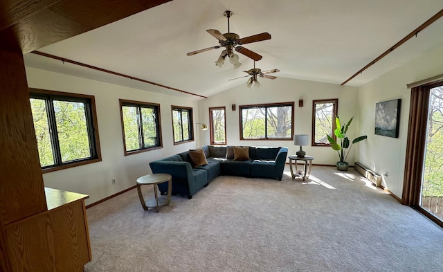 living room featuring a baseboard heating unit, vaulted ceiling, carpet flooring, a ceiling fan, and baseboards
