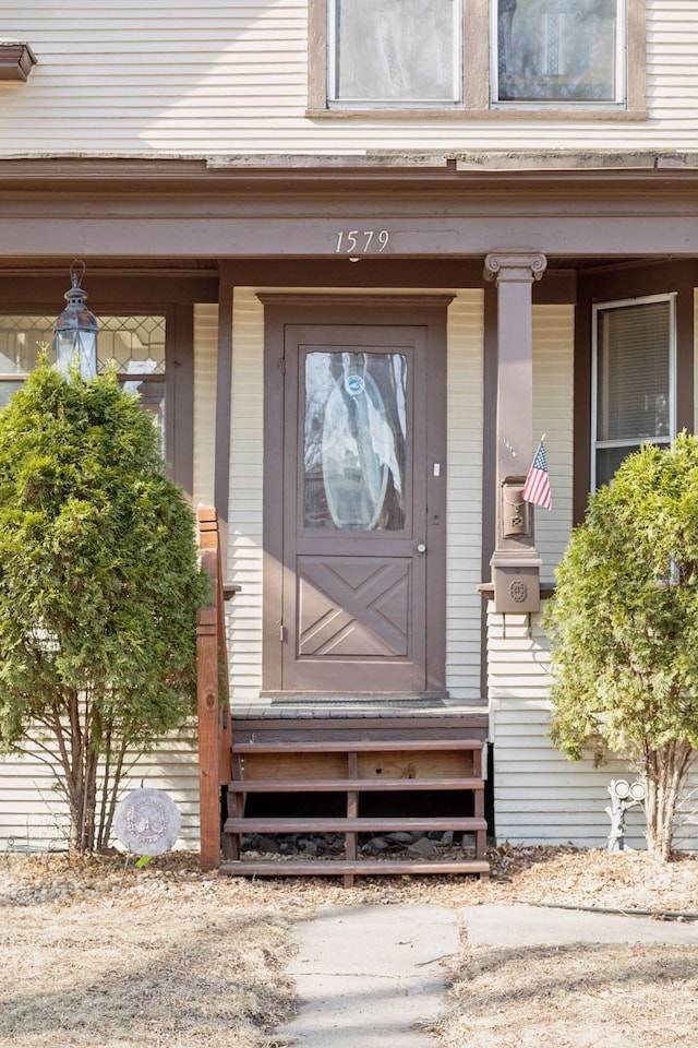 view of exterior entry with covered porch