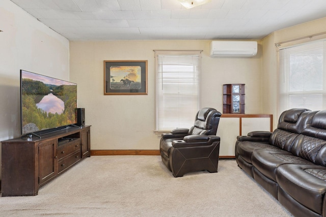 living area featuring a wall unit AC, baseboards, a wealth of natural light, and light colored carpet