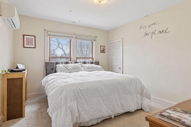 bedroom with baseboards, a wall mounted air conditioner, and light colored carpet