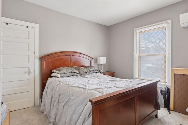 bedroom with light carpet and a wall mounted air conditioner