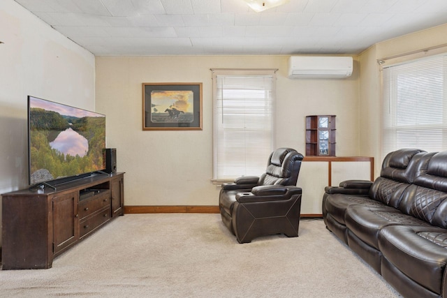living area featuring light colored carpet, baseboards, and a wall mounted AC