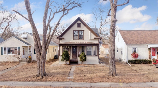 bungalow featuring central AC and covered porch