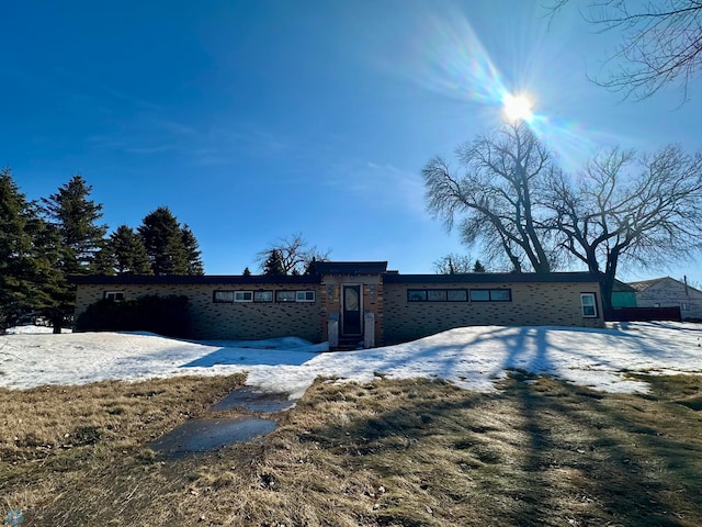 view of front of house with brick siding