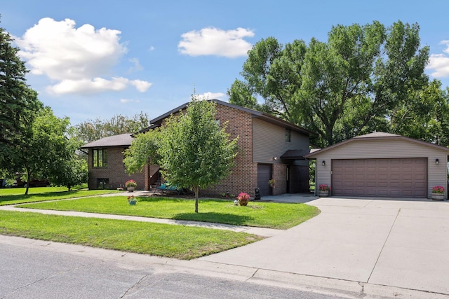 view of front facade featuring a garage, a front yard, brick siding, and an outbuilding