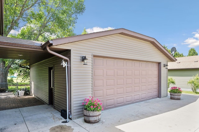 garage with fence