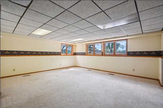 below grade area with baseboards and carpet