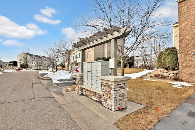 exterior space featuring mail area and a residential view