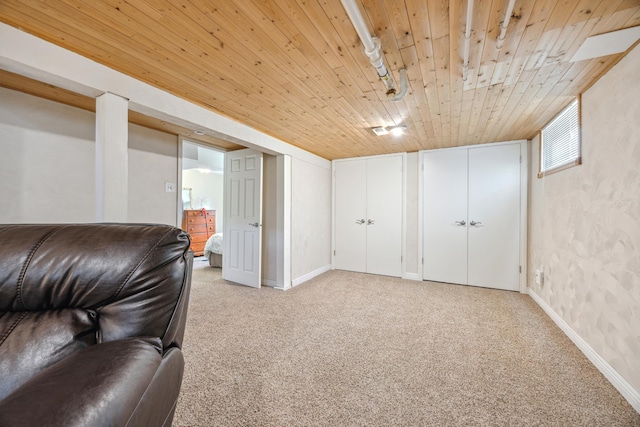 living area featuring wooden ceiling, light carpet, and baseboards