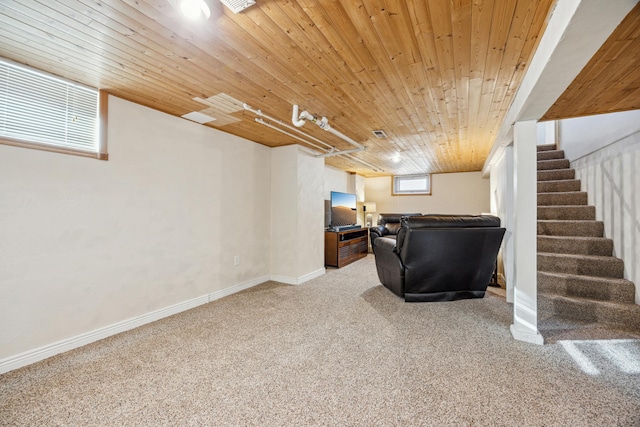 carpeted living area with wooden ceiling, baseboards, visible vents, and stairway