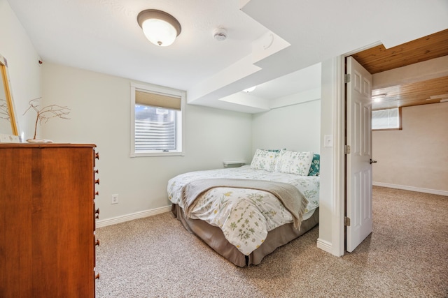 bedroom featuring carpet floors and baseboards