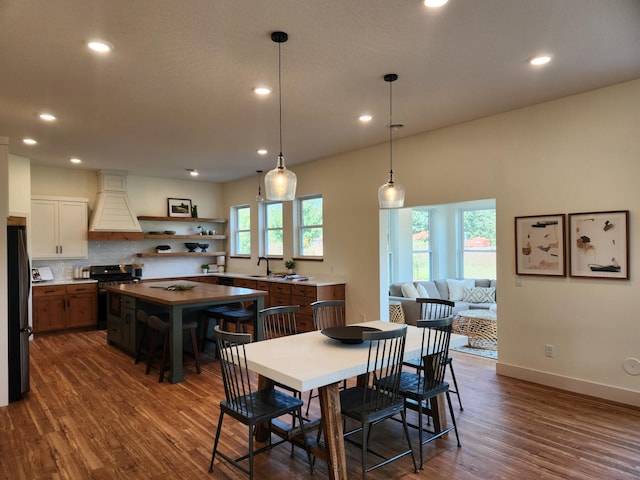 6624 Captains Cir NW, Sauk Rapids, MN 56379 - dining area with dark wood-style flooring, recessed lighting, and baseboards
