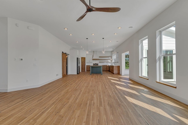 6624 Captains Cir NW, Sauk Rapids, MN 56379 - unfurnished living room with light wood finished floors, recessed lighting, a ceiling fan, and baseboards