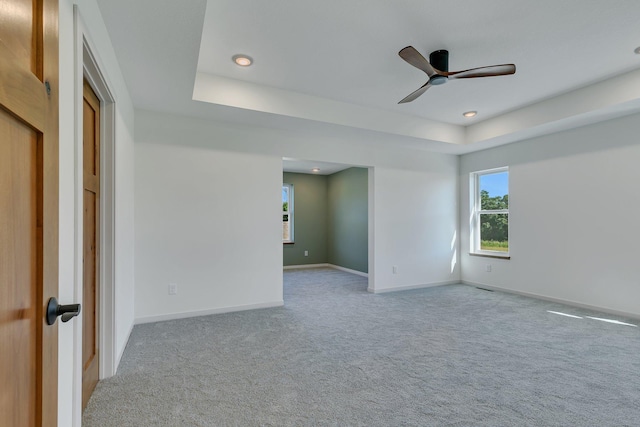 6624 Captains Cir NW, Sauk Rapids, MN 56379 - spare room with carpet flooring, a tray ceiling, baseboards, and a ceiling fan