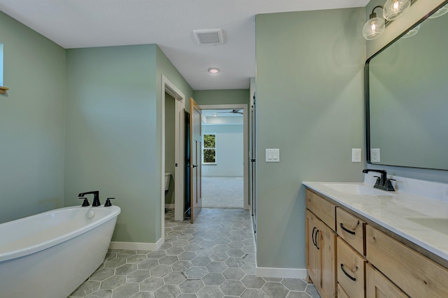 6624 Captains Cir NW, Sauk Rapids, MN 56379 - full bath featuring double vanity, a soaking tub, baseboards, and tile patterned floors