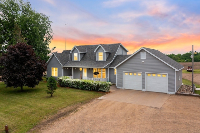 view of front of property featuring driveway, a garage, a shingled roof, a lawn, and covered porch