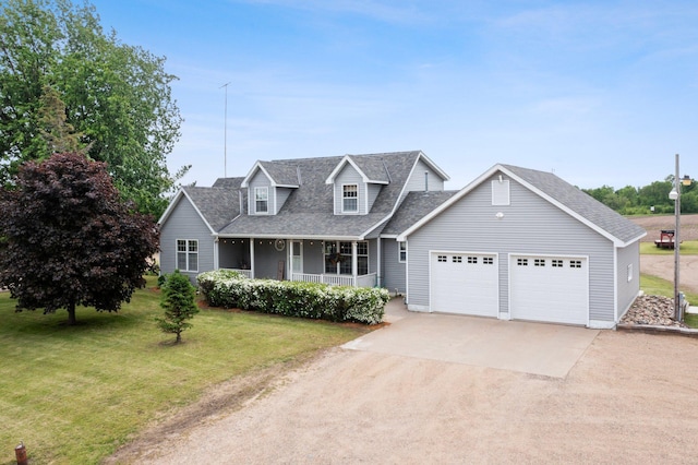 cape cod house featuring an attached garage, covered porch, a shingled roof, driveway, and a front lawn