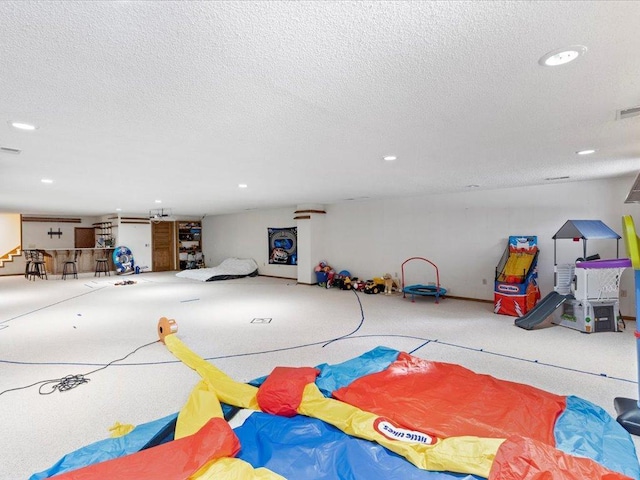 game room with visible vents, recessed lighting, and a textured ceiling
