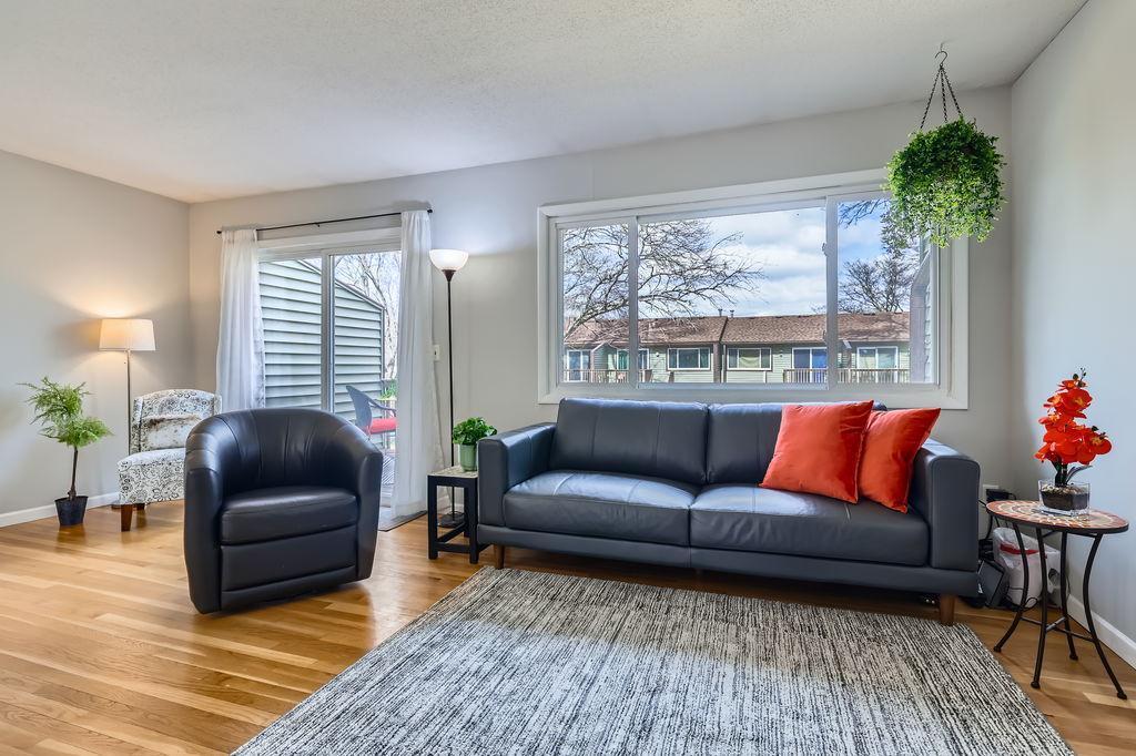 10270 Hanson Blvd NW, Coon Rapids, MN 55433 - living area featuring baseboards and wood finished floors