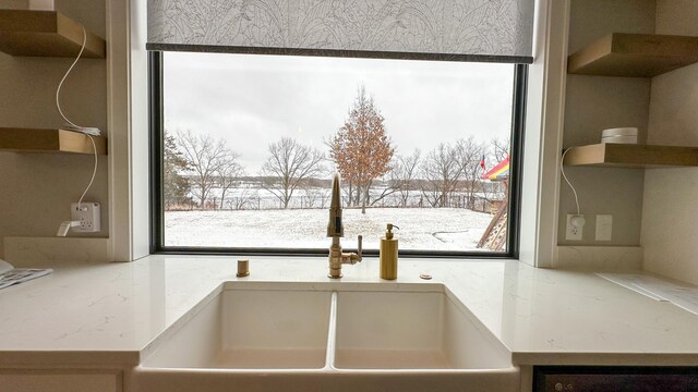 interior details with open shelves and a sink