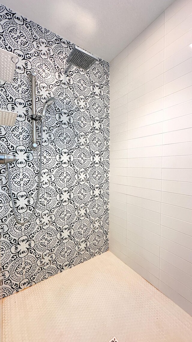 bathroom with a tile shower