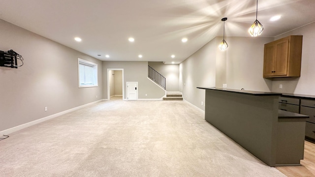 unfurnished living room with recessed lighting, light carpet, baseboards, and stairs