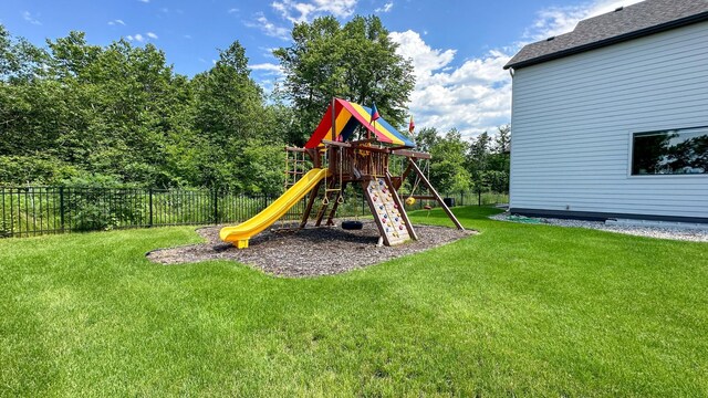 view of jungle gym featuring a yard and fence