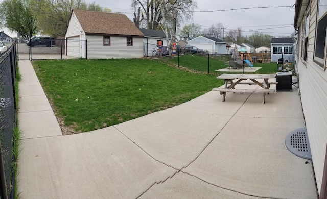 view of yard featuring an outbuilding, a patio area, a fenced backyard, and a residential view