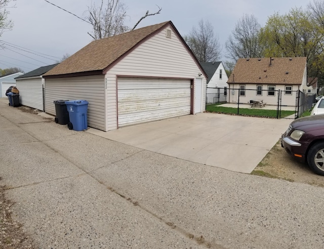 detached garage with fence