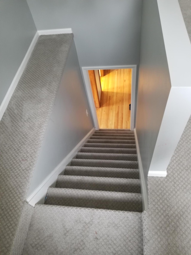 stairs featuring baseboards