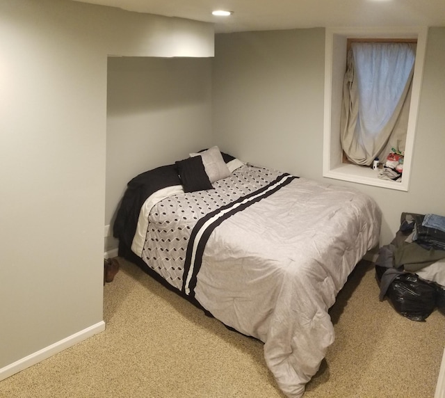 bedroom with carpet flooring and baseboards