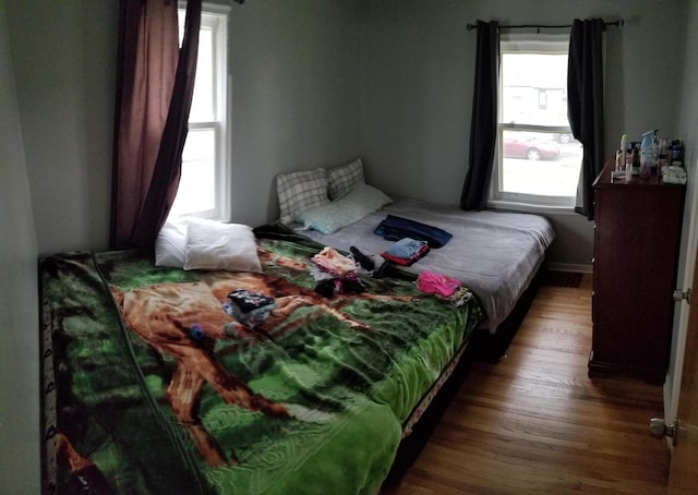 bedroom featuring wood finished floors