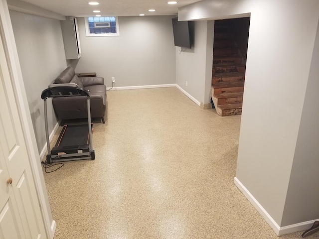 exercise room featuring baseboards and recessed lighting