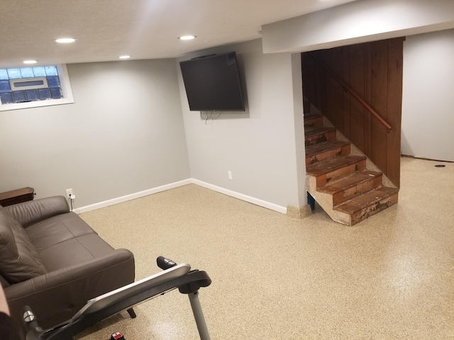 exercise area with baseboards and recessed lighting