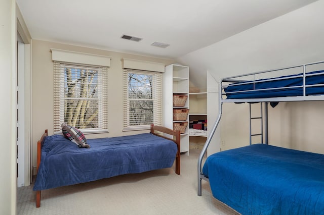 carpeted bedroom with visible vents