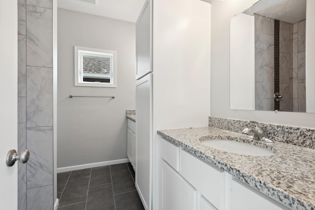 bathroom with tile patterned flooring, visible vents, vanity, and baseboards