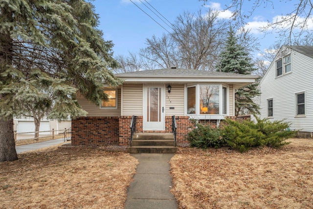 view of front of house featuring brick siding