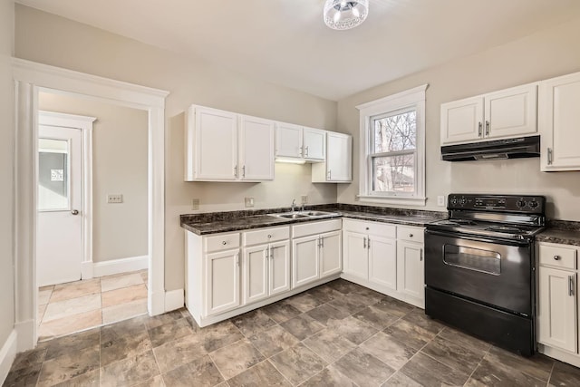 kitchen featuring under cabinet range hood, electric range, a sink, white cabinetry, and baseboards