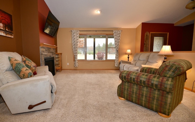 carpeted living room with a fireplace, baseboards, and vaulted ceiling