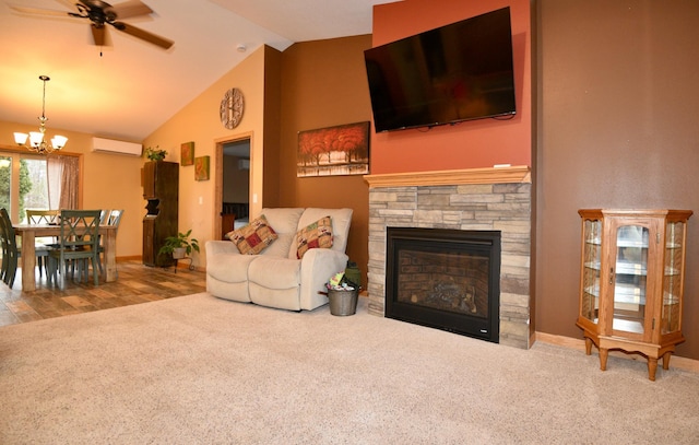 carpeted living area with a fireplace, high vaulted ceiling, a wall mounted air conditioner, baseboards, and ceiling fan with notable chandelier