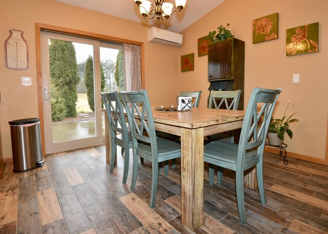 dining space featuring an inviting chandelier, vaulted ceiling, wood finished floors, a wall mounted air conditioner, and baseboards