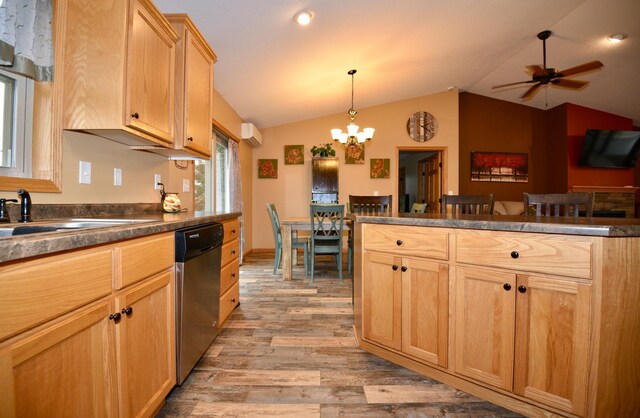 kitchen featuring light wood-style floors, dark countertops, vaulted ceiling, and dishwasher