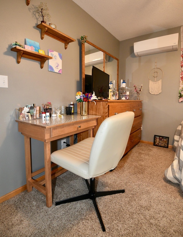 office with a wall unit AC, baseboards, and carpet floors