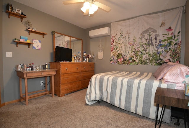 carpeted bedroom with a ceiling fan, a wall mounted air conditioner, and baseboards