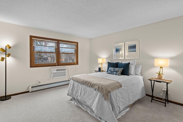 bedroom featuring baseboard heating, carpet flooring, baseboards, a wall mounted AC, and a textured ceiling
