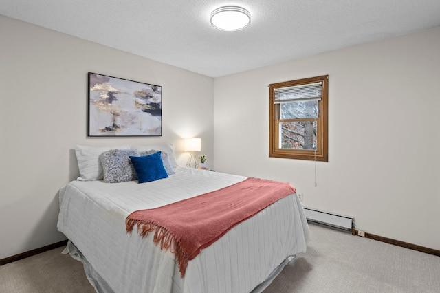 carpeted bedroom featuring a baseboard radiator and baseboards
